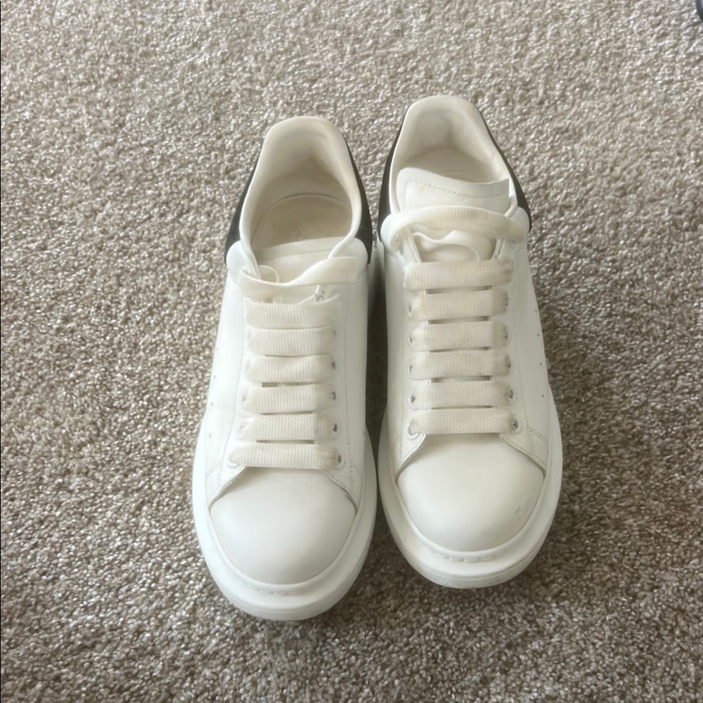Alexander McQueen White Sneakers with Black Heel Accent.